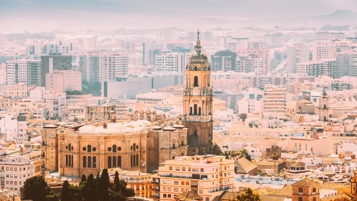 Málaga cathedral rising above the rooftops of the historic centre in soft morning light